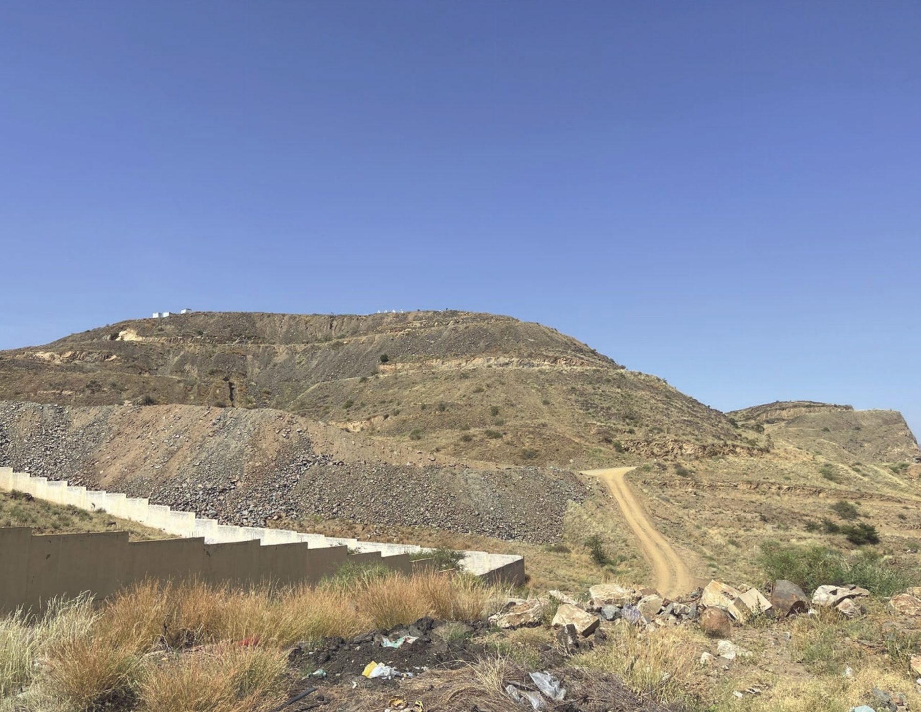 The site's hill seen from its surroundings